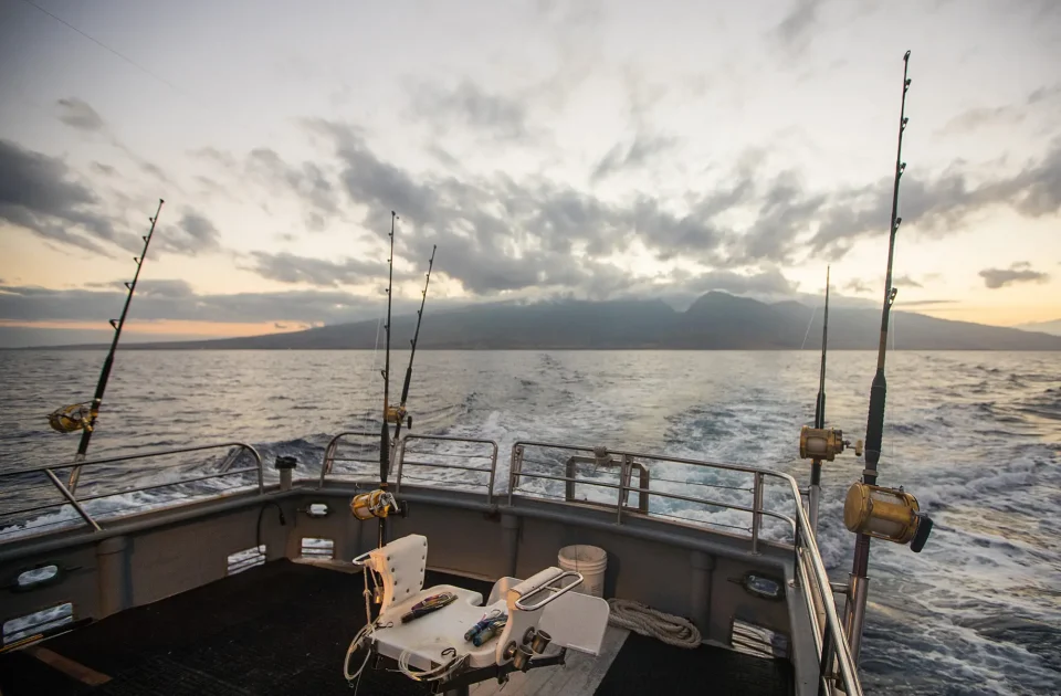 Deep Sea Fishing Reel on a boat during sunrise